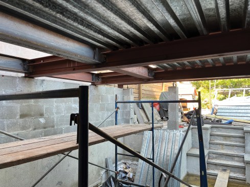 Short, intersecting I-beams are added between the main beams.