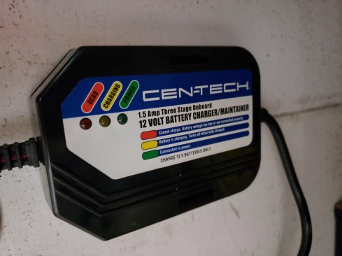 Attached to it is a “battery tender”, or trickle charger, to help top off the battery when the trailer is plugged in to shore power.