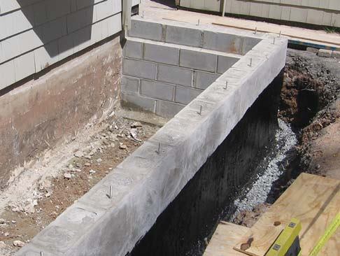 A coat of cold asphalt supplies another layer of protection against moisture.