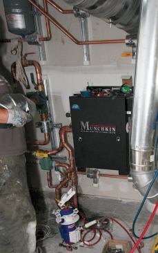 The Munchkin boiler will fire whenever the collectors are unable to keep the water in the storage tank at or above 120 degrees.
