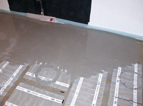 While the mats can be covered with thinset, the author prefers to use a self-leveling underlayment.
