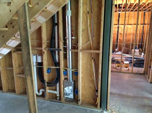 The back side of the laundry room wall showing the Dryer Box in place with an upflow exhaust.