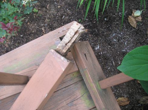 Notching a 4x4 post to fit into a corner seriously compromises the strength of the post.