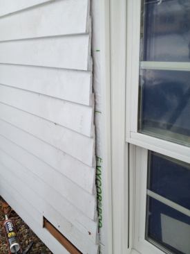 Raw wood like the cut ends of clapboards is vulnerable to absorbing moisture which can cause paint to fail prematurely, (or worse can lead to rot. A coat of fast-drying primer seals the cut ends before trim goes on).