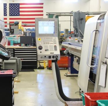 As far as I could tell nearly every machine in the factory is controlled by computer. Everywhere I went I saw control panels such as the one on this newer CNC (computer numeric control) machine. The older machines (not that there were very many of them) had similar panels.