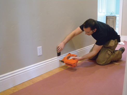 Locating the studs with an inexpensive Zircon stud finder.