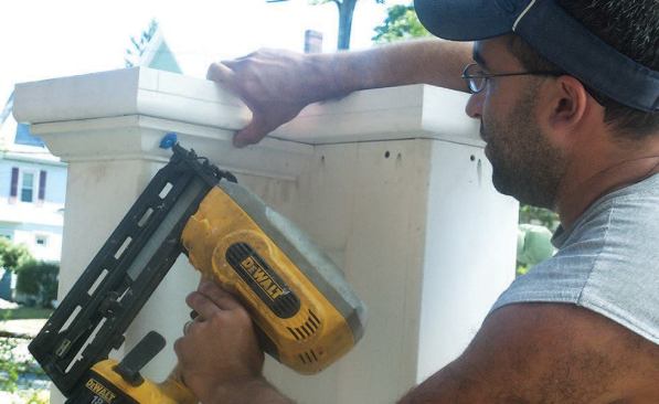 The completed pedestals were slipped in place over the framed knee walls, then trimmed with PVC moldings to hide fastener holes.