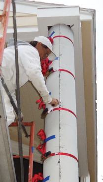 As we tightened our ratchet straps, a few areas deflected under the pressure and didn't line up properly, but wood shims underneath the straps corrected the problem.