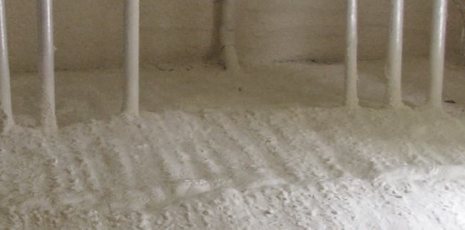 Plumbing penetrations can be tricky to plug with rigid foam board; SPF seals seamlessly around obstacles with a few passes of the spray gun.