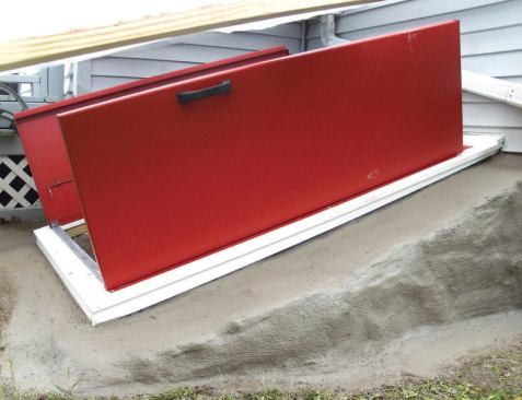 Installing the Access Cover: Finally, I parged the existing curb. First I removed loose mortar and repacked the larger gaps, then I brushed on Weldbond (weldbond.com), a bonding agent that seals the porous concrete and helps the new mortar adhere. I immediately followed with the new mortar. To close up the gaps between the curb and the PVC trim, I used a tube of Quikrete mortar caulk; I applied this to both the inside and the outside of the frame and cap. This project took me about two days, including the time to remortar the curb. Depending on the amount of extra repair work involved, bulkhead replacements typically sell for $1,500 to $2,500.