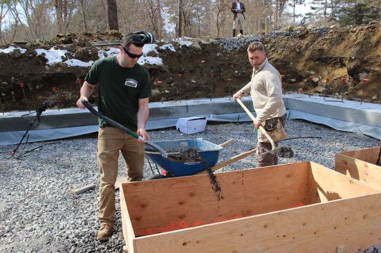 Casey and Tim shovel crusher run into the plywood form.