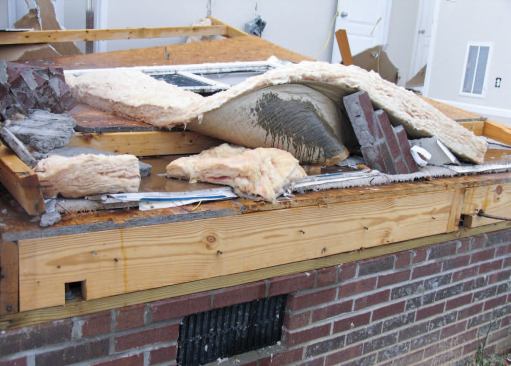 Another collapsed home was fully sheathed with OSB, which lapped the rim board and sill plate but was fastened only to the rim board with 16-penny nails at approximately 16 inches on-center. I could see no nails through the sheathing into the sill plate.
