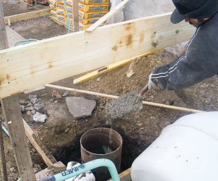 I then place concrete inside the tube, filling it about a third of the way up.