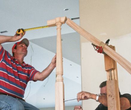 The handrail transitions to a 42-inch-high level balcony rail.