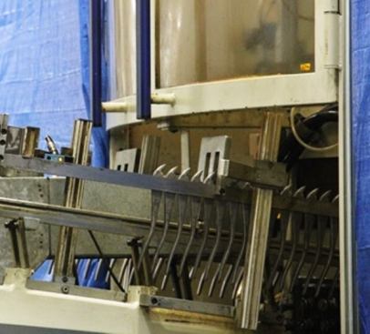 Here’s a shot of forgings being fed into the super-secret automated machining center. They come out the other end machined and ready for assembly. What happens while they are in there is anyone’s guess, though it’s reasonable to assume they are clamped a minimal number of times (maybe only once) and undergo multiple machining operations after.