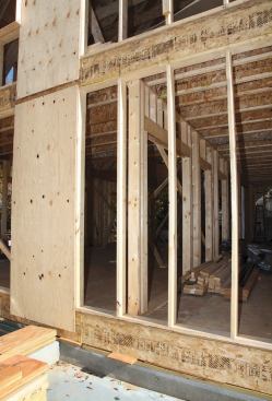 Where interior partitions intersect exterior walls, horizontal ladder blocking will secure the end stud, keeping the wall bay fully open and accessible for insulation.