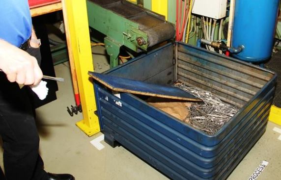 It’s easier to understand how the tips of slotted screwdrivers are made. In this plant they stamp the end flat, send the piece out for plating, and then grind the tip to final shape. This is the machine that stamps the tip flat.