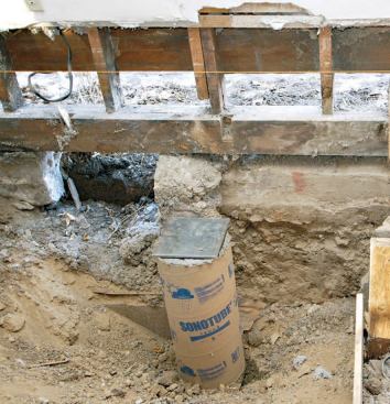 Each pier was topped with a steel-reinforced concrete pier; a steel bearing plate was embedded in the wet concrete at exact finish height.