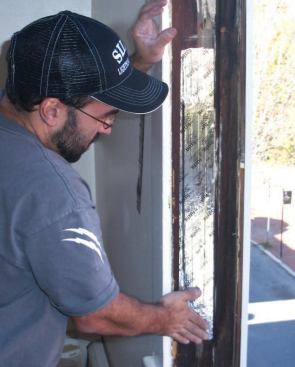 I pull the batt material back down snugly against the bottom of the pocket and fill the top of the pocket with small pieces. I replace the pocket covers, then cover the holes with foil-faced tape.