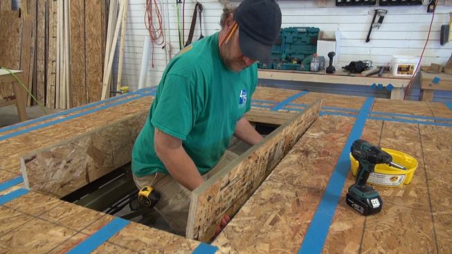 Steve Greenleaf builds the inboard portion of a window buck into a framed window opening in the interior 2x4 portion of the wall panel, using 1?-by-9.5-inch rim board. Windows will be set flush with this inner buck.