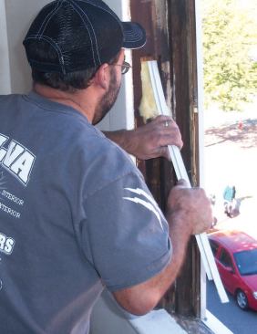 I cut some fiberglass insulation to size, then use a strip of flexible metal to push it up into the pocket from the bottom access opening until I can see it at the top.