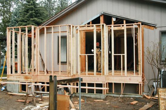 The author's crew framed the addition walls with engineered studs — which are straighter than sawn studs — to speed wall tile installation.