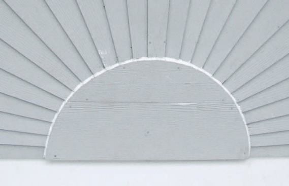 I then installed the fiber-cement "sun" on top of the plywood template and carefully caulked the joints at the bottom of the rays.