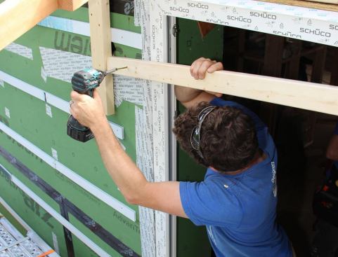 Taking down the temporary rail. The installed window is now ready for head flashing and trim.