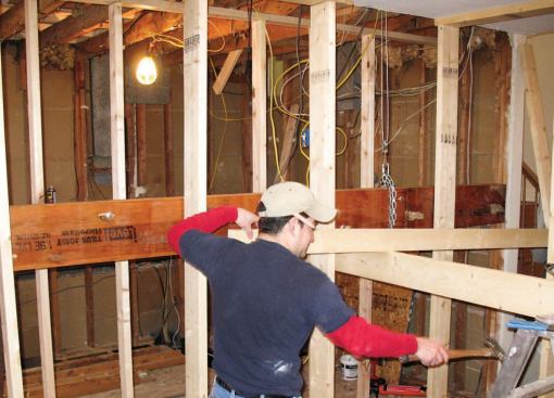 A pair of come-alongs rigged in the attic helped hoist it into place.