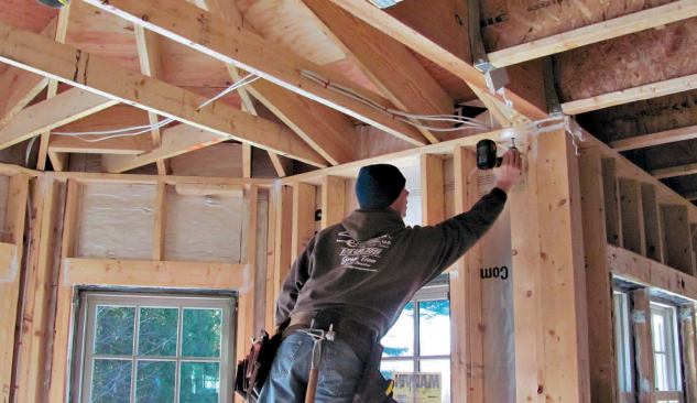 The floors are framed with 14-inch I-joists on 2-foot centers. TimberLok structural screws replace metal ties for faster, code-approved rafter hold-downs.