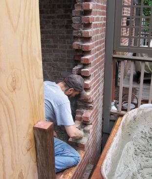 Since the final brickwork will be exposed, the bricks must be toothed in preparation for rebuilding the new rough opening.