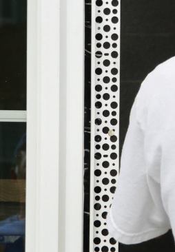 This vinyl J-bead is designed to accommodate expansion and contraction between the window frame and the abutting stucco.