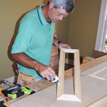 Glue is applied to the assembled panels.