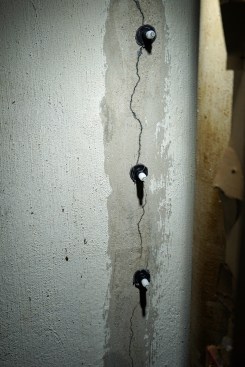 Toby sticks a port over each drilled hole.