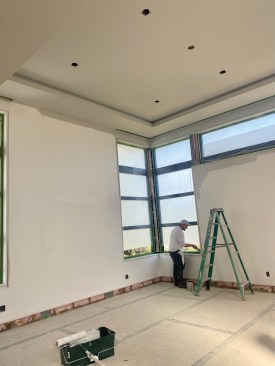 The plasterers returned to finish plastering the ceiling and walls before paint.