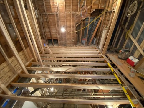 A view of the new framing, including new joist that tie into the new rim joist at left.