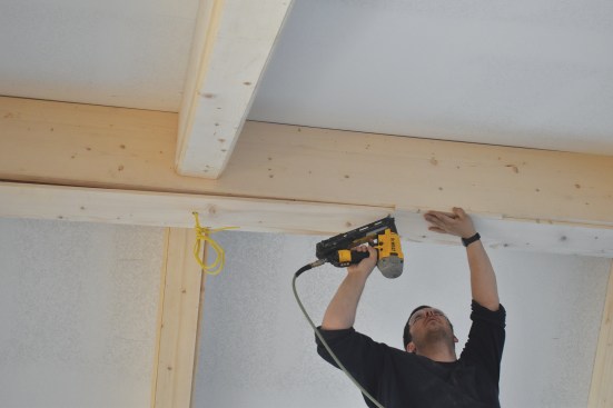 The bottom panel is attached to the previously installed blocking on the side panels