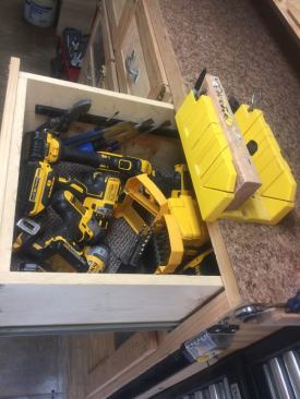 The drawers below the counter contain a variety of tools; this one is devoted to DeWalt 20V MAX tools and accessories.
