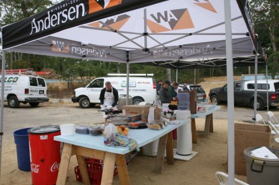 Behing the scenes, volunteers prepare dinner for all the workers at the jobsite: Fuel for the Blitzers!