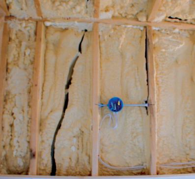 Closed-cell foam applied in lifts that are too thick is subject to overheating, which can lead to subsequent shrinkage and cracking — a problem that may not become evident until months after the applicator has packed up and left. The lighter-colored areas of foam mark the location of cracks that had been filled in an earlier attempt at repairing the still-ongoing shrinkage.