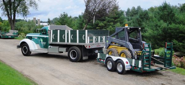 This is “Pinocchio” (a 1947 GMC longnose) hauling a skid steer. Litzenburger says he can run the business using vintage trucks because the basic design—or layout—of stake beds and pickups has improved very little since trucks were invented. The machines used for landscaping are a completely different matter, and for that he uses only modern equipment.