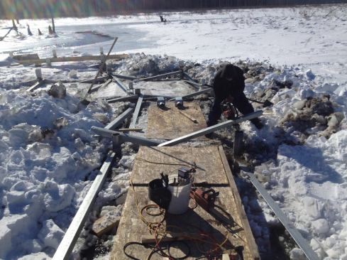 Once the 2-inch dia. piles were in place, the crew installed galvanized anchor brackets and L4x4x1/2 cross-bracing.