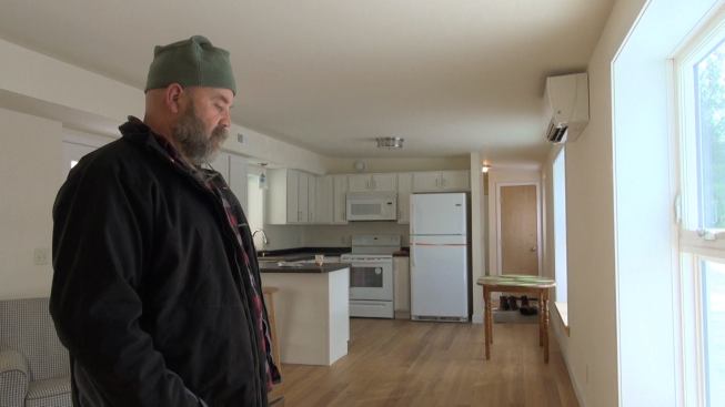 VerMod founder Steve Davis stands in the open-plan kitchen-livingroom of a recently completed unit. "It's a thousand-square-foot two-bedroom, two-bath ranch house," he says. To Davis' rear is a duct chase that supplies fresh conditioned air to a bedroom and bath.