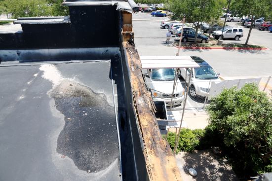 I climbed up to the roof for a better look. Luckily, the demo crew wasn't quite finished so I got to see some of the layers behind the stucco.