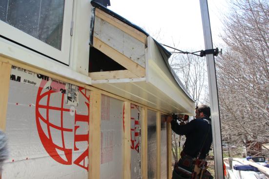 A seven-sixteenths-inch-thick strip is installed below the soffit to act as padding for the frieze board and bed molding.