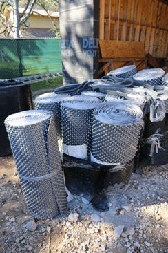 Delta Dry Stucco & Stone comes in rolls that look alot like a foundation waterproofing product. It’s a plastic dimple mat on the back.