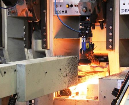 An electric arc flash heats the bottom of the upper for a few seconds before it is lowered into the form.