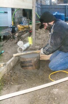 I then run the straightedge across the top in a saw motion to smooth the surface.