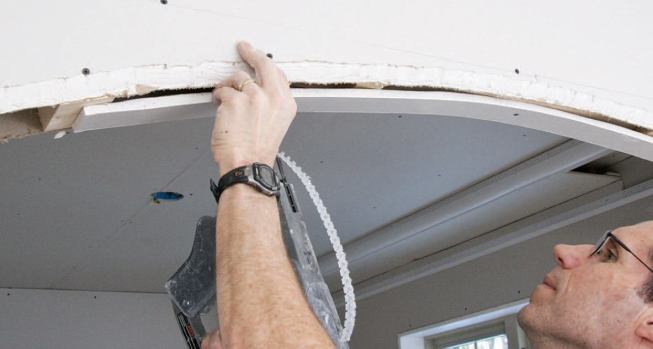 A strip of drywall is used to finish the arch.