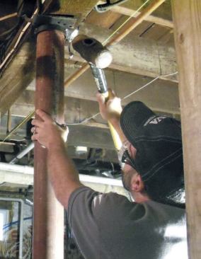 I then set the cap on top of the column and angle it into position on top of the base plate, using a sledgehammer for persuasion.